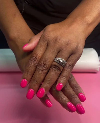 Bright pink dip powder manicure by Matcha Nails